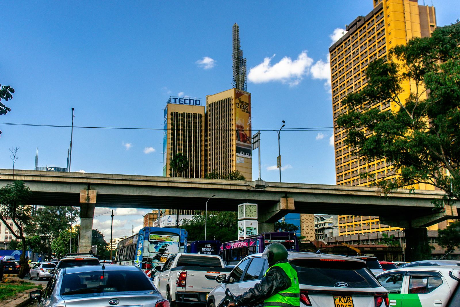 Street-level traffic beneath an overpass in Nairobi, Kenya