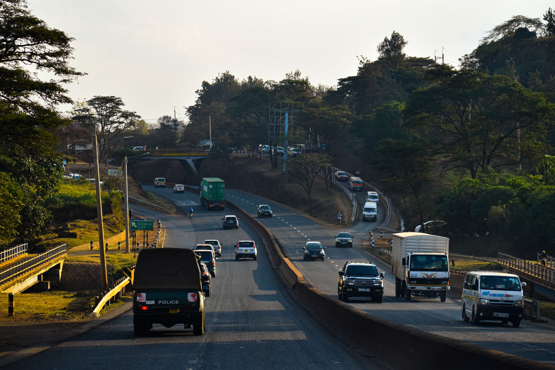 Passenger and cargo vehicles moving along a highway in Nairobi, Kenya